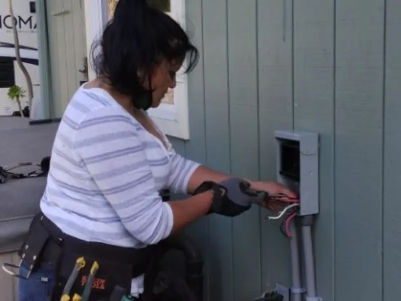 Licensed electrician wiring an exterior subpanel in Jonesborough